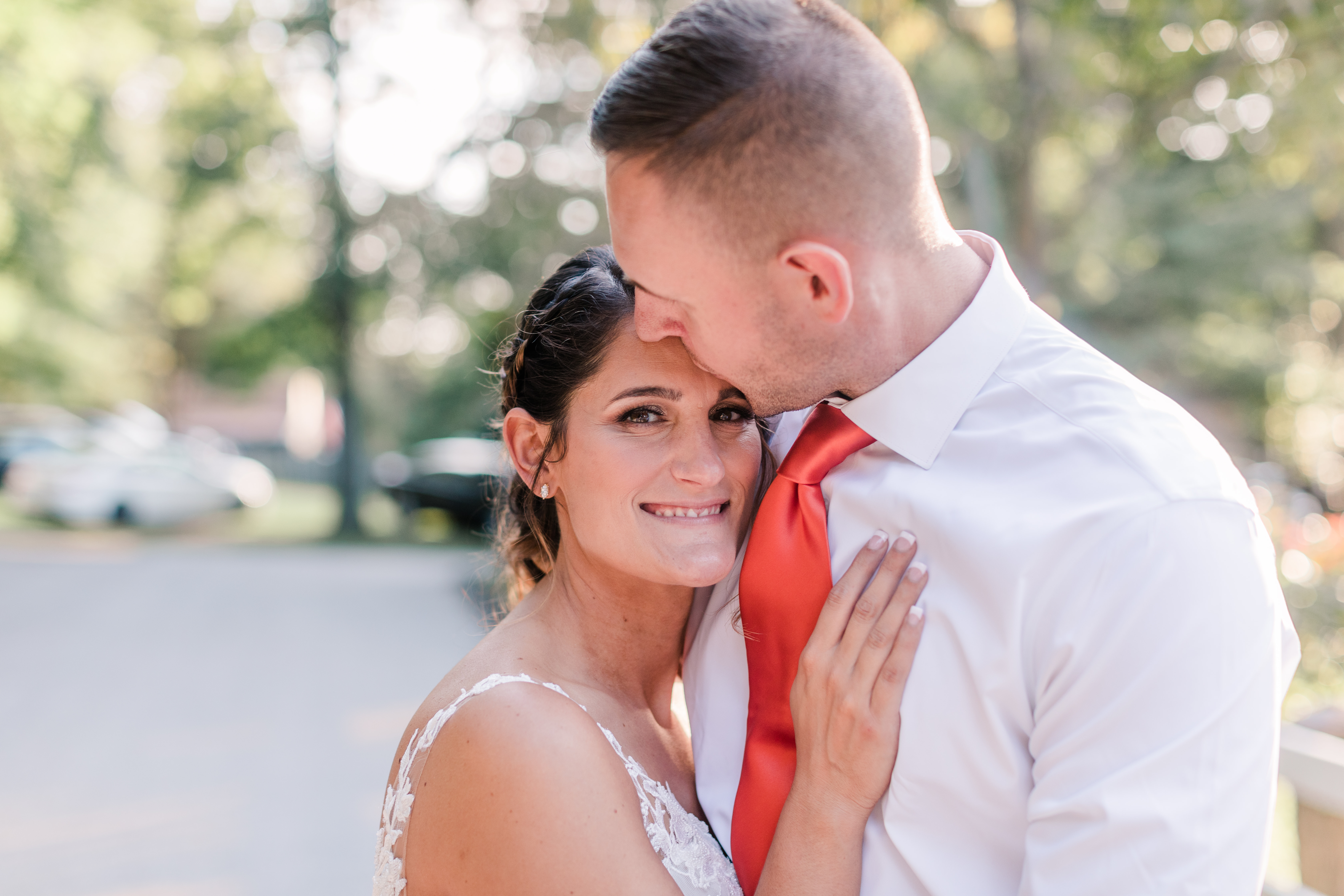 Bride and groom cuddle