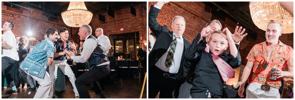 Wedding guests showing off dance moves at reception. Mix of generations enjoying celebration with dramatic lighting from venue's crystal chandeliers