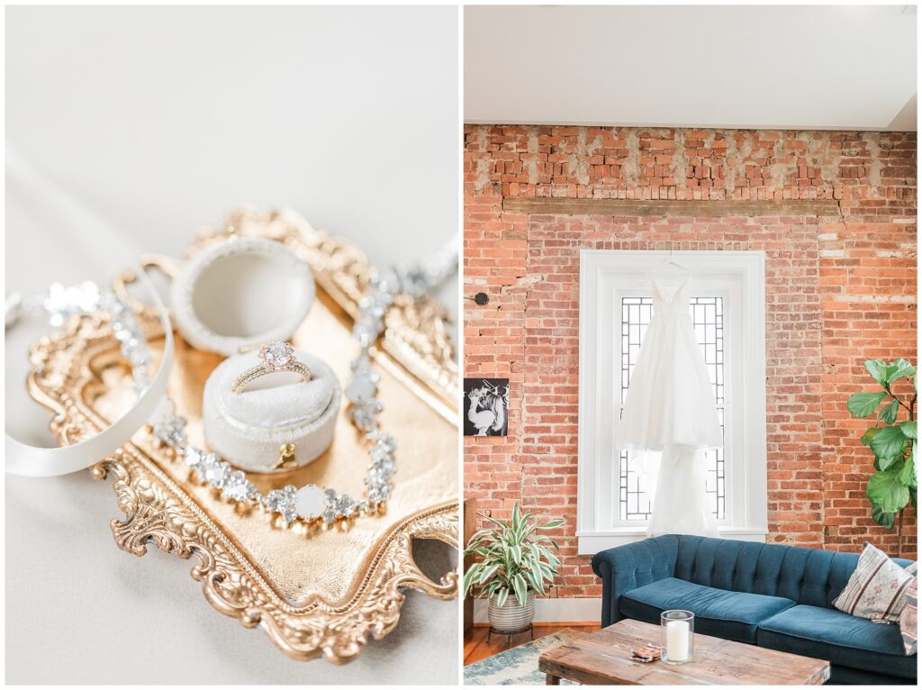 Wedding details featuring engagement ring and bridal jewelry on gold vintage tray, with bridal gown displayed against exposed brick wall in historic Frederick venue