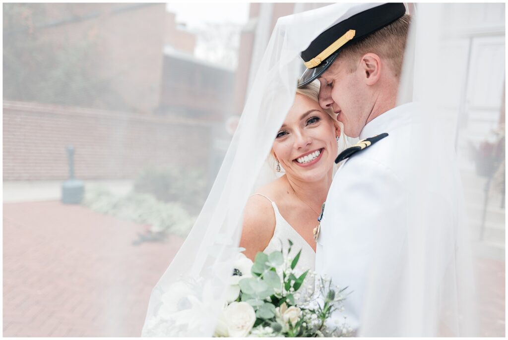 Naval aviator and bride intimate portrait with classic veil and eucalyptus bouquet at Maryland wedding