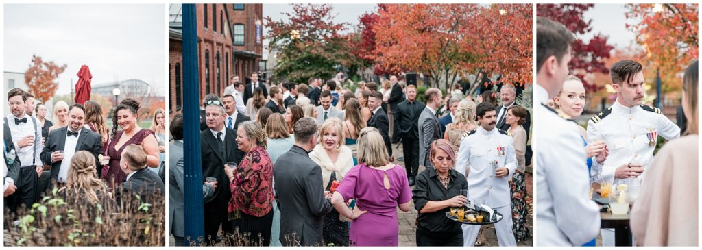 Fall wedding cocktail hour at Union Mills Public House with naval officer in dress whites, guests mingling on historic brick patio with autumn foliage