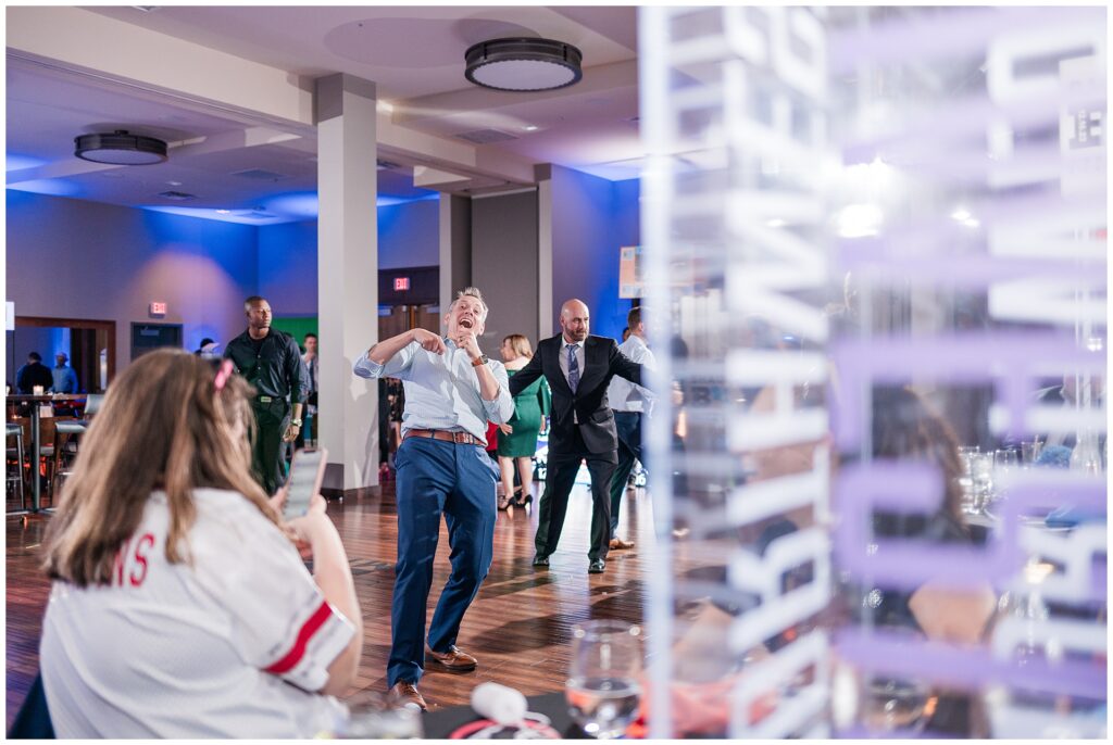 Parents dancing during a Maryland Bar Mitzvah at Pinstripes — joyful adult celebration moments with decor in the background