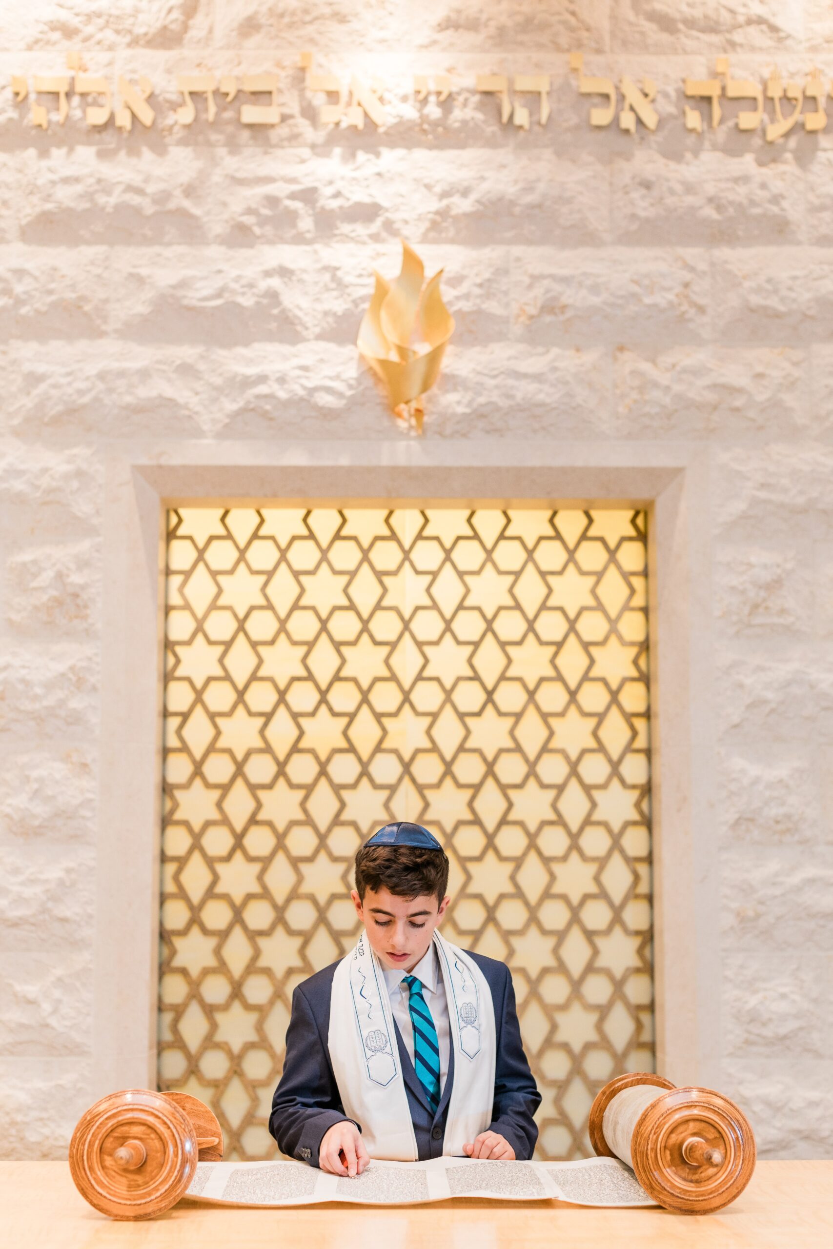 Bar Mitzvah boy reading Torah at Temple Isaiah in Fulton, Maryland — traditional portrait by a Bar Mitzvah photographer in Howard County