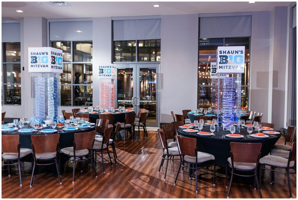Reception decor at Pinstripes North Bethesda for a Maryland Bar Mitzvah — table setup with custom lighting and bold college basketball theme