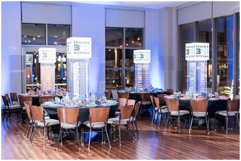 Basketball-themed Bar Mitzvah reception decor at Pinstripes North Bethesda — Maryland event photography with modern table styling and custom lighting