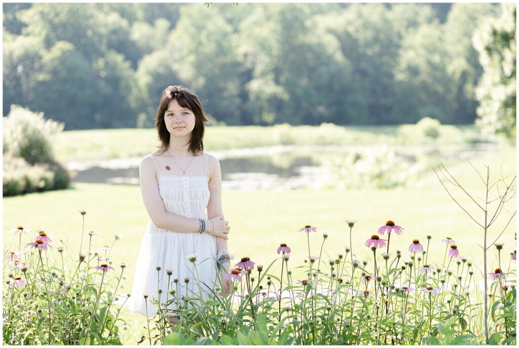 A senior from Atholton high school takes her senior photos in Maple Lawn, Fulton Maryland in a field of wildflowers