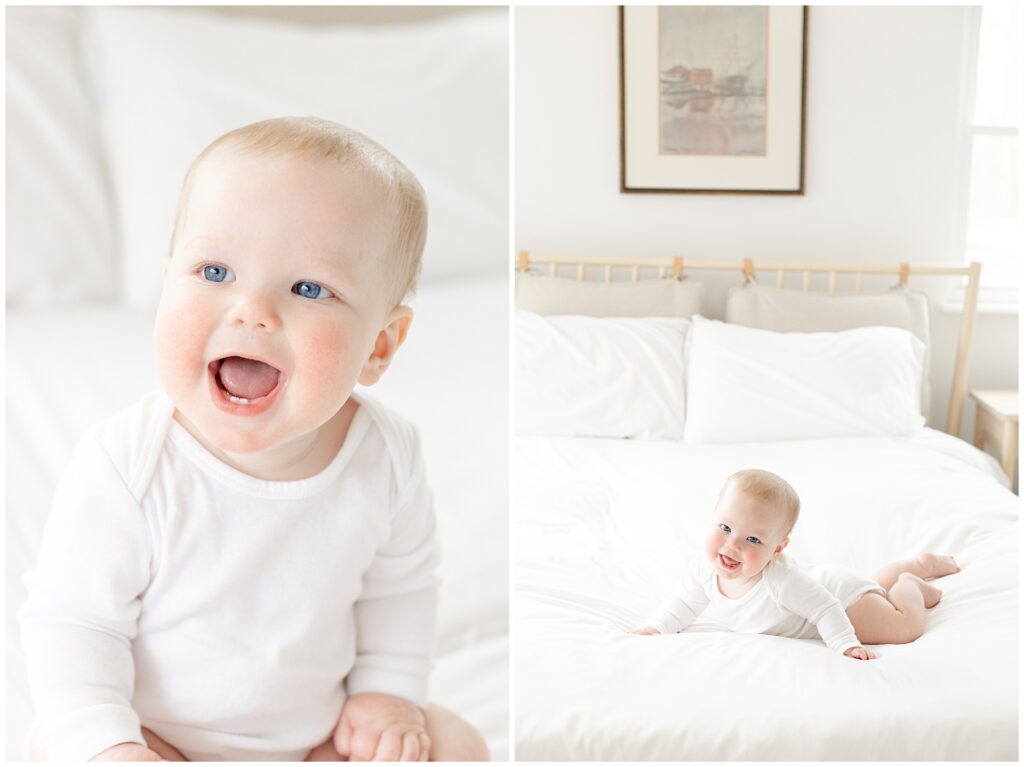 Eight-month baby portrait on a white bed, wearing a white onesie for monthly milestone session
