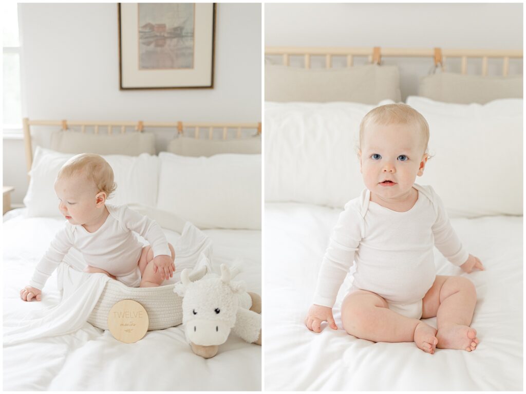 Twelve-month milestone portrait with baby in white onesie on bed, photographed in Maryland home