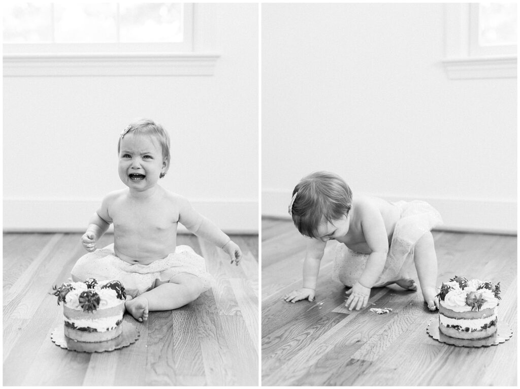Twin girls sitting with individual strawberry shortcakes during a first birthday cake smash session at home in Montgomery County, Maryland.