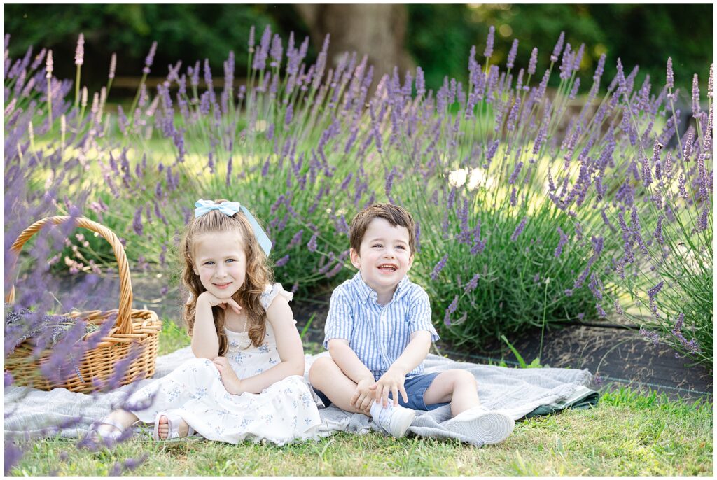 Lavender mini session featuring two kids on picnic blanket at Karis Lavender Farm during Montgomery County mini session; coordinated family styling and soft natural light for timeless portraits