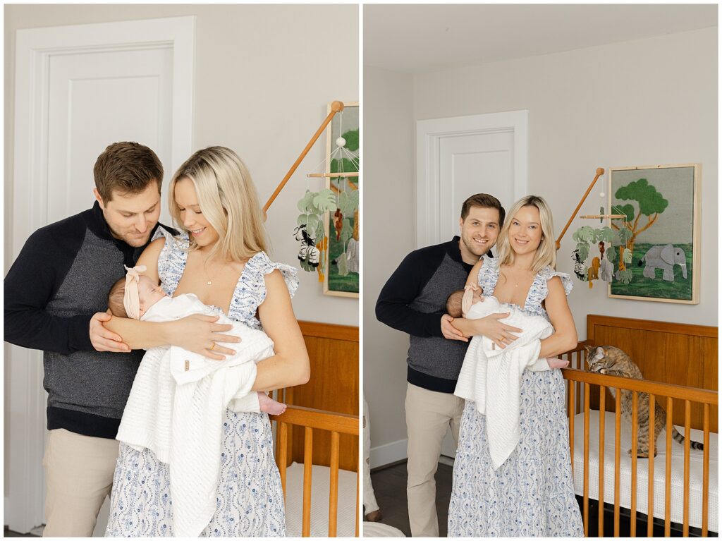 Mom in a white and blue floral dress  holds her baby girl in their newborn home session, in Virginia. Dad in a blue sweater hold his wife and they all smile at the camera.