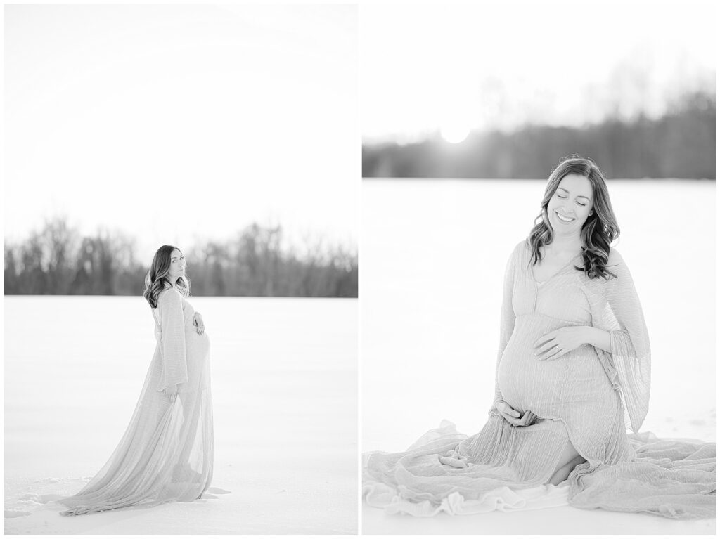 Black and white fine art style photo of a pregnant woman sitting in the snow looking off to the side during her snow maternity session in Maryland