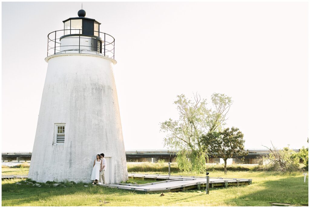 Editorial, Vouge inspired engagement photo of a couple at Piney Point Lighthouse in Maryland